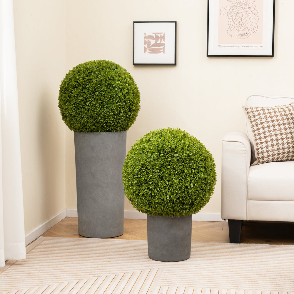 Two artificial topiary spheres in concrete planters, perfect for patio or balcony decoration, with lifelike boxwood.