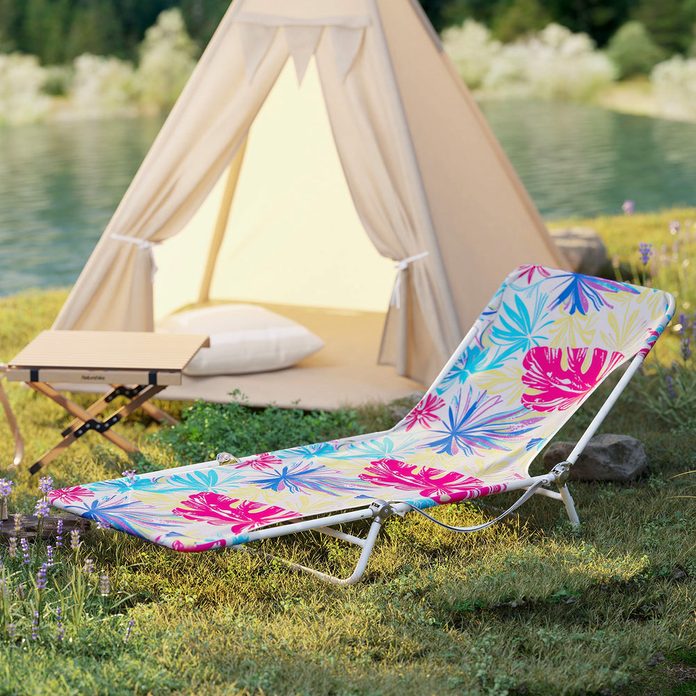 5-position adjustable beach recliner in pink with floral design, perfect for camping or poolside relaxation.