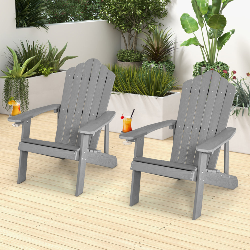 Two ergonomic silver Adirondack chairs set on a wooden patio, perfect for porch and backyard relaxation.