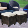Two-piece patio rattan ottoman set with beige removable cushions, perfect for outdoor seating and versatile use.
