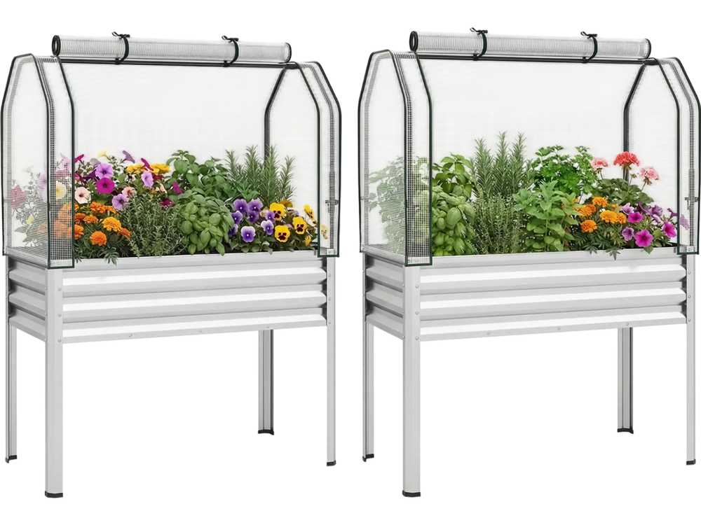 Galvanized raised garden bed with greenhouse cover, ideal for growing vegetables and flowers, featuring a roll-up door.
