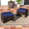 Two navy cushioned outdoor patio ottomans made of hand-woven PE wicker, perfect for extra seating or footrests.