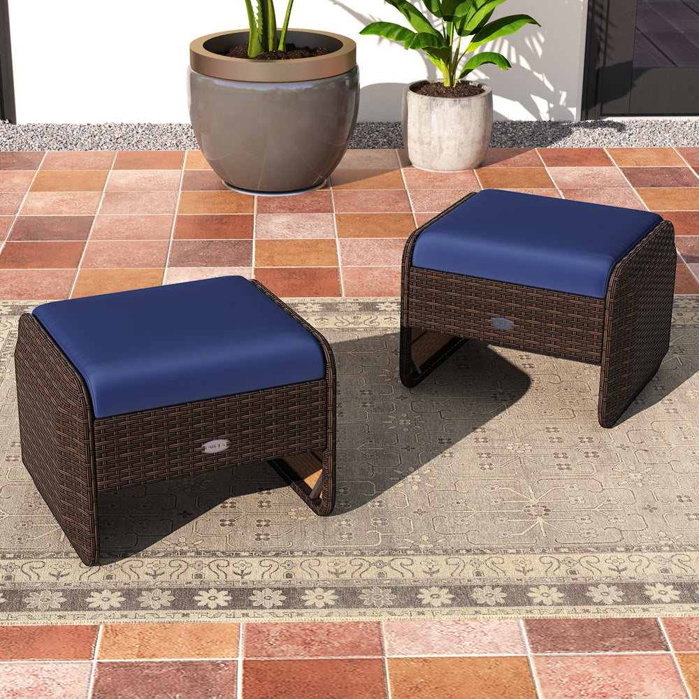 Two navy cushioned outdoor patio ottomans made of hand-woven PE wicker, perfect for extra seating or footrests.