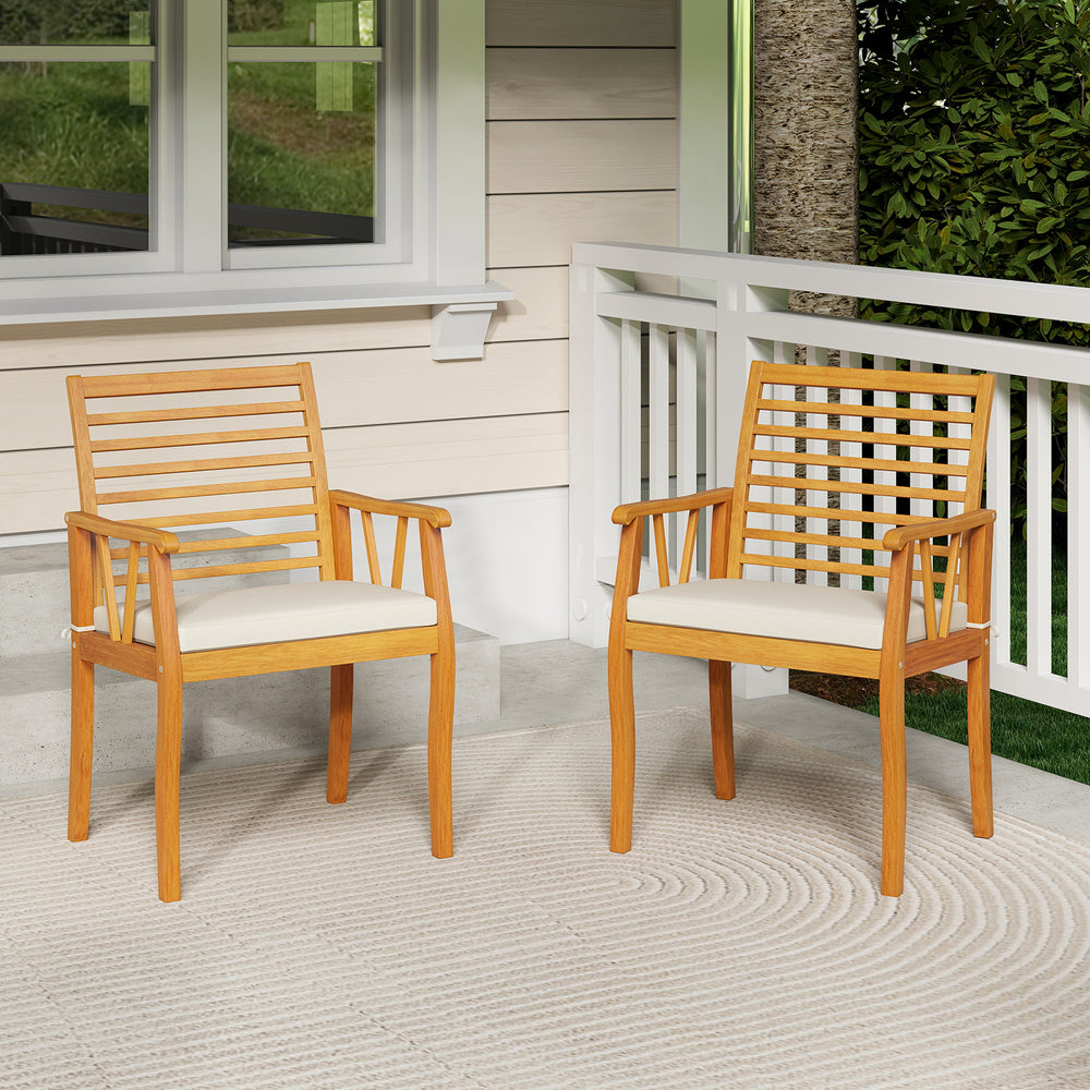 Two acacia wood patio dining chairs with removable cushions, perfect for outdoor bistro conversations on a porch.
