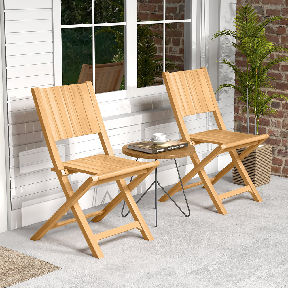 Two teak wood outdoor dining chairs with slatted seats, perfect for patio relaxation and compact storage.