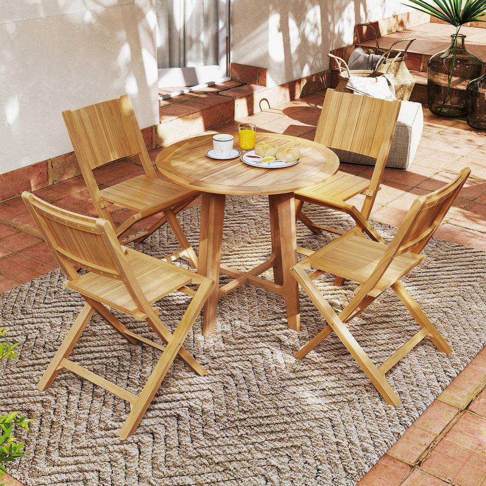 Teak wood outdoor dining set featuring four folding chairs and a round table, perfect for patio relaxation.
