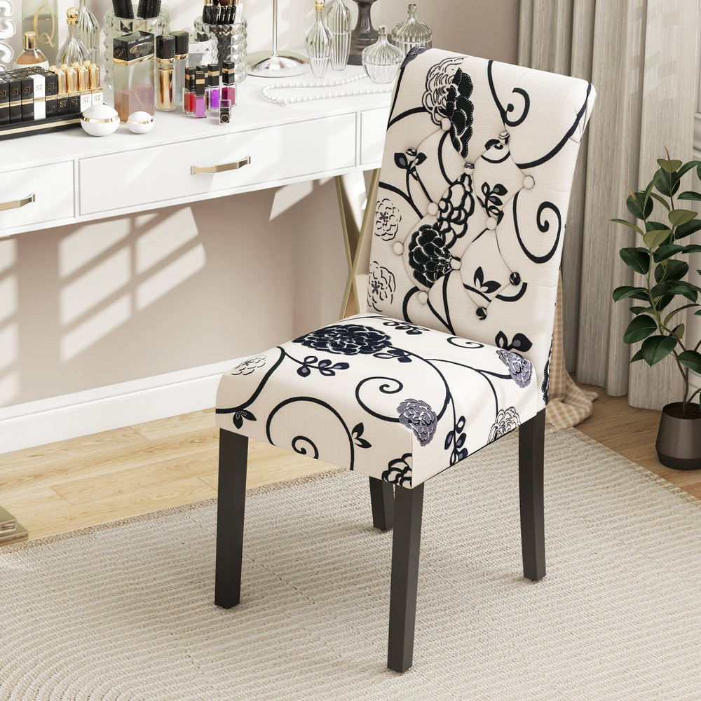 Tufted dining chair with blue and white linen fabric, curved backrest, and sturdy wood legs for comfort and stability.