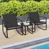 Two black rocking bistro chairs with a glass-top table, perfect for poolside relaxation or balcony use.