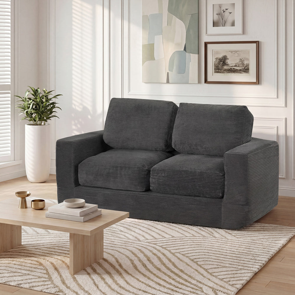 Black 2-seater floor couch loveseat with removable corduroy cover, high-density foam, perfect for cozy lounging.