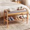 Bamboo shoe bench with gray padded cushion, featuring a slatted shelf for storage, perfect for entryway or bedroom use.