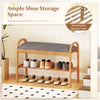 2-tier bamboo shoe bench with gray padded cushion and slatted shelf, perfect for hallway storage and seating.
