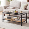 Rectangular black 2-tier coffee table with rubber wood frame and PVC rattan shelf, ideal for living room organization.