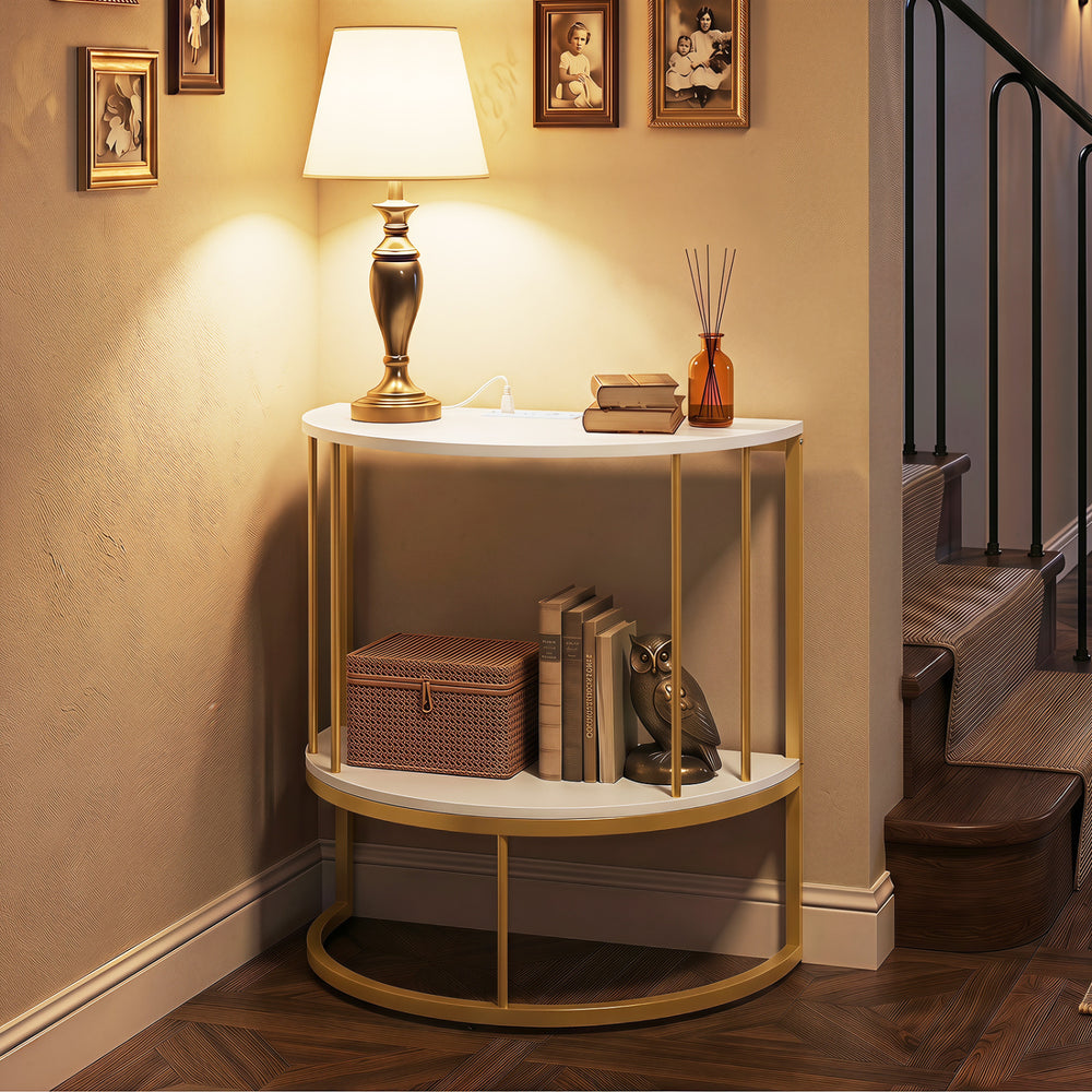 Half moon console table in white with gold frame, featuring storage shelves and built-in power outlets for versatile use.