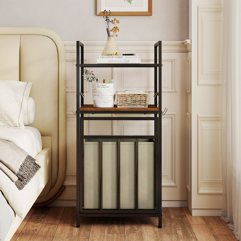 2-tier laundry hamper in black with tilt-out basket, perfect for organizing laundry in stylish bedroom decor.