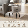 Versatile 2-tier end table in white with raised metal legs, perfect for living rooms or bedrooms to hold lamps and decorations.