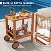 2-tier rolling serving cart with built-in wine bottle holders, teak oil finish, perfect for outdoor gatherings.