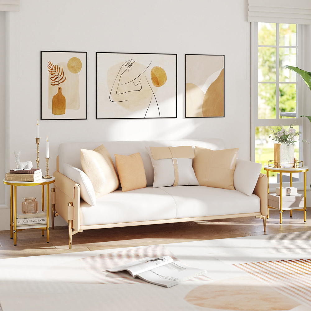Round coffee table with faux marble top and golden metal frame, featuring a storage shelf for living room organization.