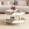 Round coffee table with a split-color tabletop, metal frame, and storage shelf for organized living spaces.