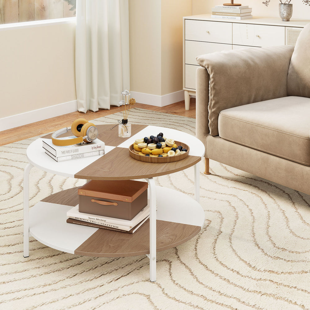 Round 2-tier coffee table in natural and white with metal frame, featuring a split-color tabletop and storage shelf.