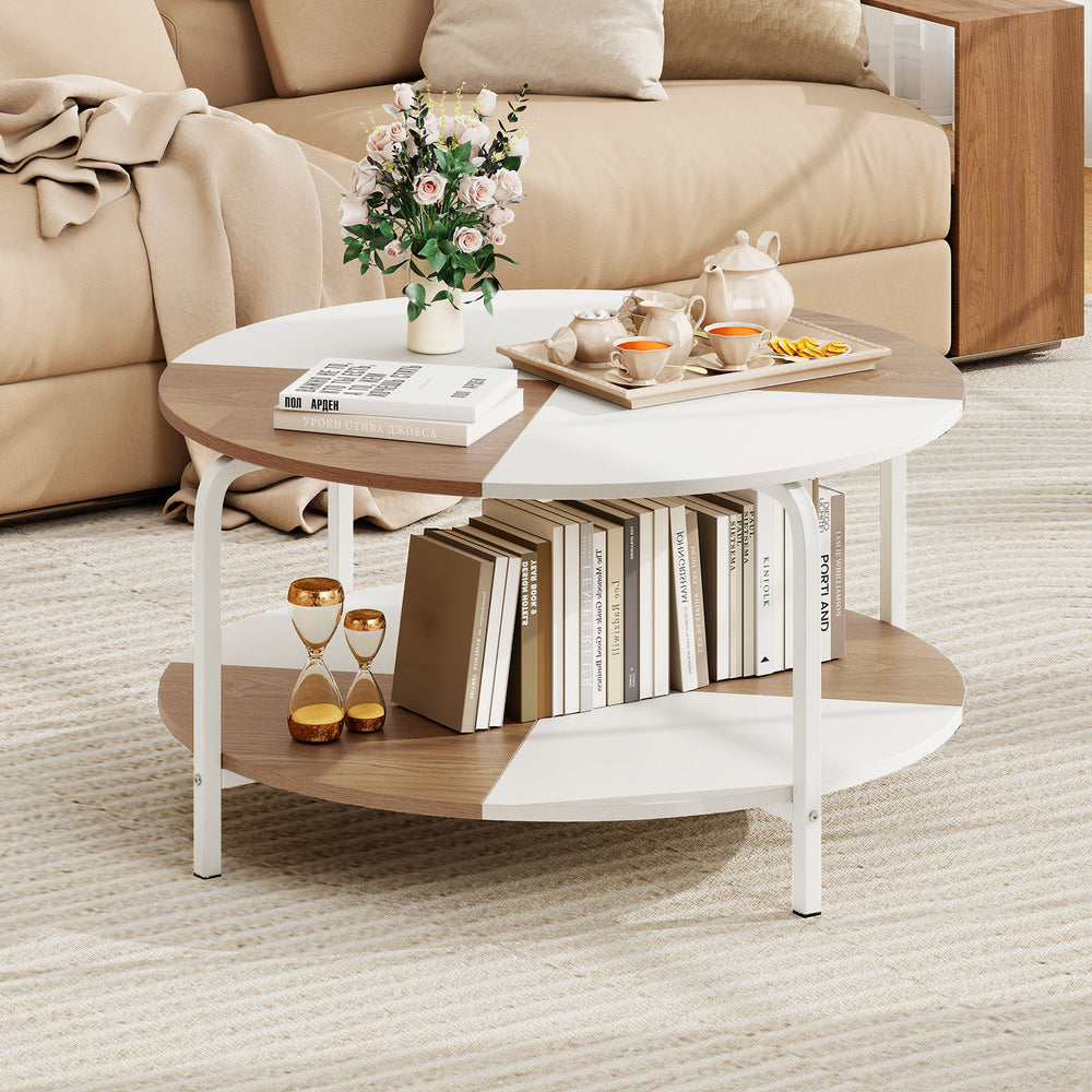 Round coffee table with a natural and white split-color tabletop, featuring a metal frame and 2-tier storage shelf.