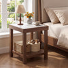 Walnut 2-tier square side table with faux marble top beside a bed, shown with decor in a bedroom setting.