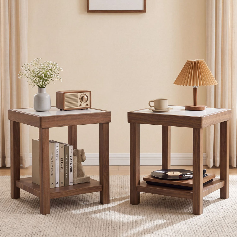 Two brown square side tables with 2-tier design and faux marble tops, styled beside a sofa in a living room.