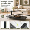 2-tier black coffee table with tempered glass top and storage shelf, featuring a reinforced metal frame for stability.
