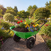 Heavy-duty light green wheelbarrow cart with flowers and soil, featuring a steel frame and 13-inch pneumatic tires.