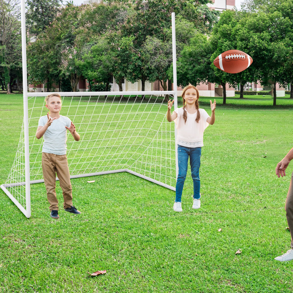 Children playing with a 2 in 1 all-weather football training goal in a park, suitable for soccer and football training.