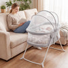 2-in-1 baby bassinet in grey with breathable mesh, featuring rocking motion and zippered canopy for safe sleep.