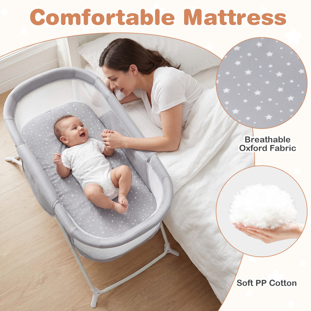2-in-1 baby bassinet in grey with breathable mesh, soft PP cotton mattress, and rocking motion for comfortable sleep.