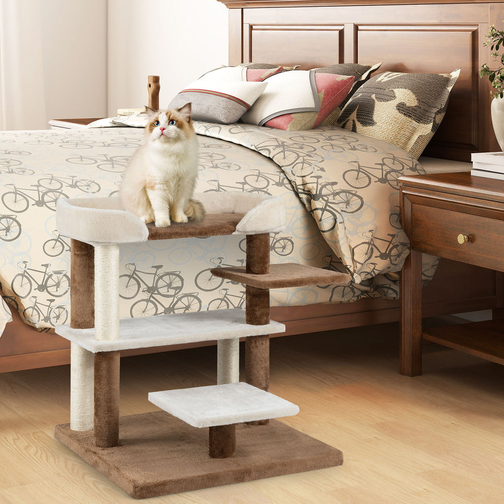 Cat tree tower with 4 large platforms and sisal scratching posts, perfect for climbing and relaxing, in brown color.