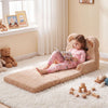 Cozy 2-in-1 foldable kids sofa bed with bear design, perfect for lounging or reading in a playful bedroom setting.
