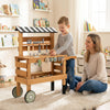 Kids rolling cart with play tools set in brown, featuring a workbench and large wheels for easy mobility and.