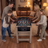 Family enjoying the 2-in-1 swivel game table, featuring foosball and pool, with sturdy brown finish for fun gameplay.
