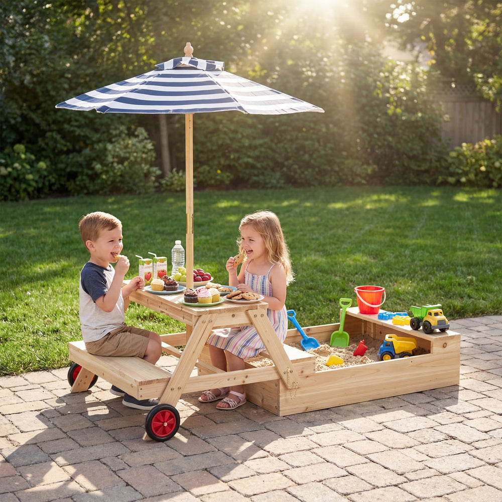 Kids enjoying snacks at the 2-in-1 wooden sandbox with foldable umbrella and convertible picnic table in a backyard.