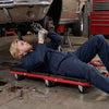 Z-shaped rolling garage stool in creeper mode, featuring a cushioned seat and heavy-duty frame for automotive repair.