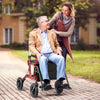 2-in-1 foldable rollator walker in red with a seat, adjustable height, and pneumatic tires, ideal for seniors outdoors.
