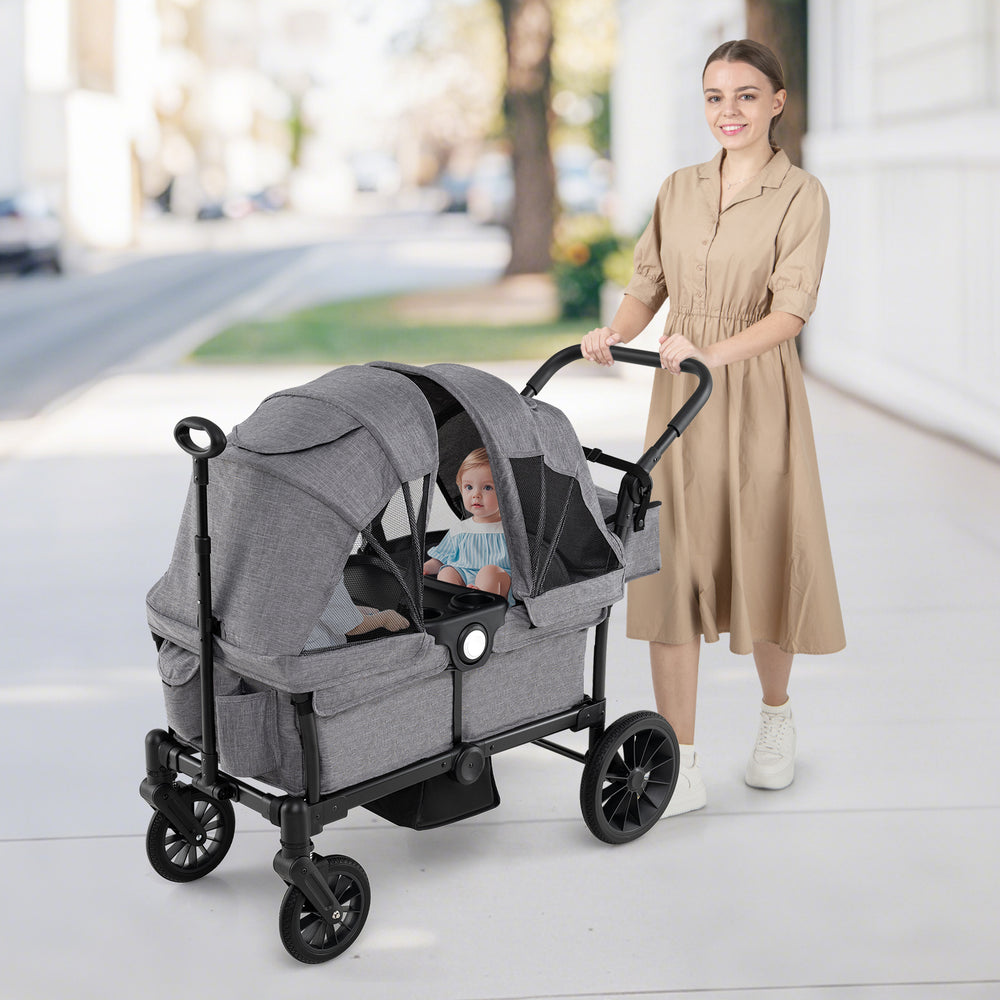 2-seater gray kids wagon stroller with adjustable handlebars, sun canopy, and safety harness for comfortable outings.
