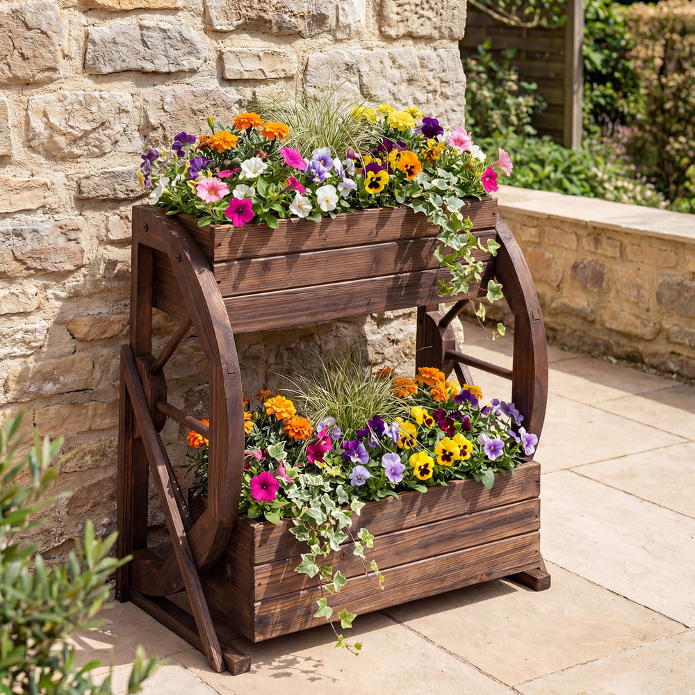 2-tier rustic wood wagon planter with drainage holes, featuring vibrant flowers, perfect for garden decoration.