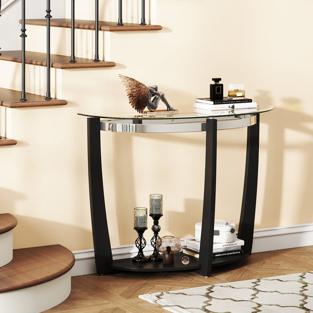 Half-moon tempered glass console table with black rubber-wood legs and open shelf for stylish storage and decor.