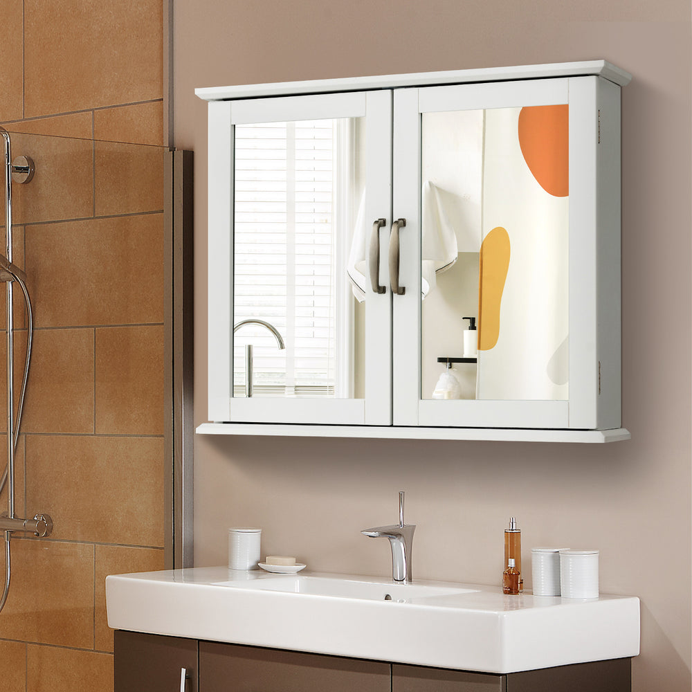Wall-mounted white bathroom storage cabinet with double mirrored doors and metal handles, ideal for organizing.