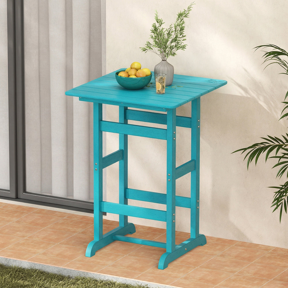 Turquoise 30-inch square bar table with slatted tabletop, ideal for poolside or balcony dining. Weatherproof HDPE.