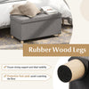 Detail view of the rubber wood legs and protective foot pads of the gray 30-inch storage ottoman bench, ensuring floor.