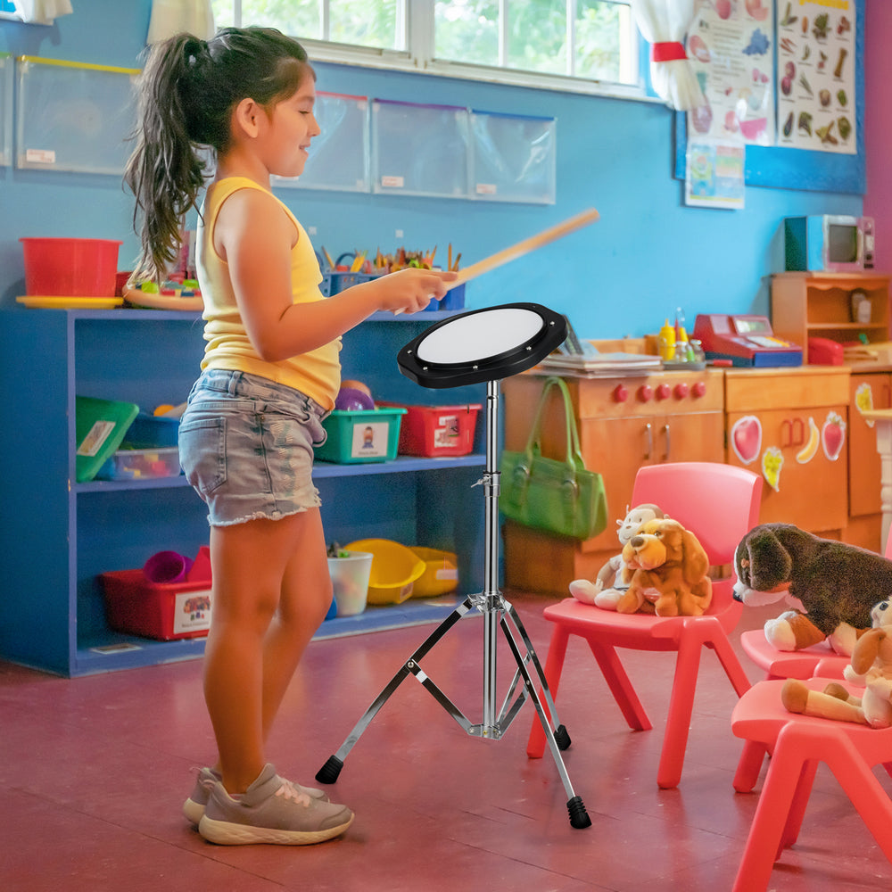 Child practicing on a 30-note percussion set with adjustable stand and mallets in a colorful classroom setting.