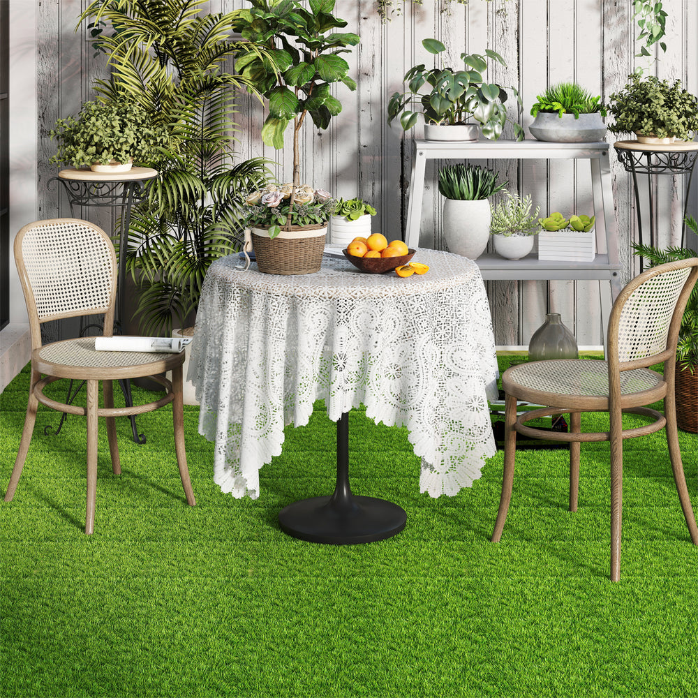 Interlocking artificial grass tiles with a lush, realistic appearance, perfect for indoor and outdoor use.