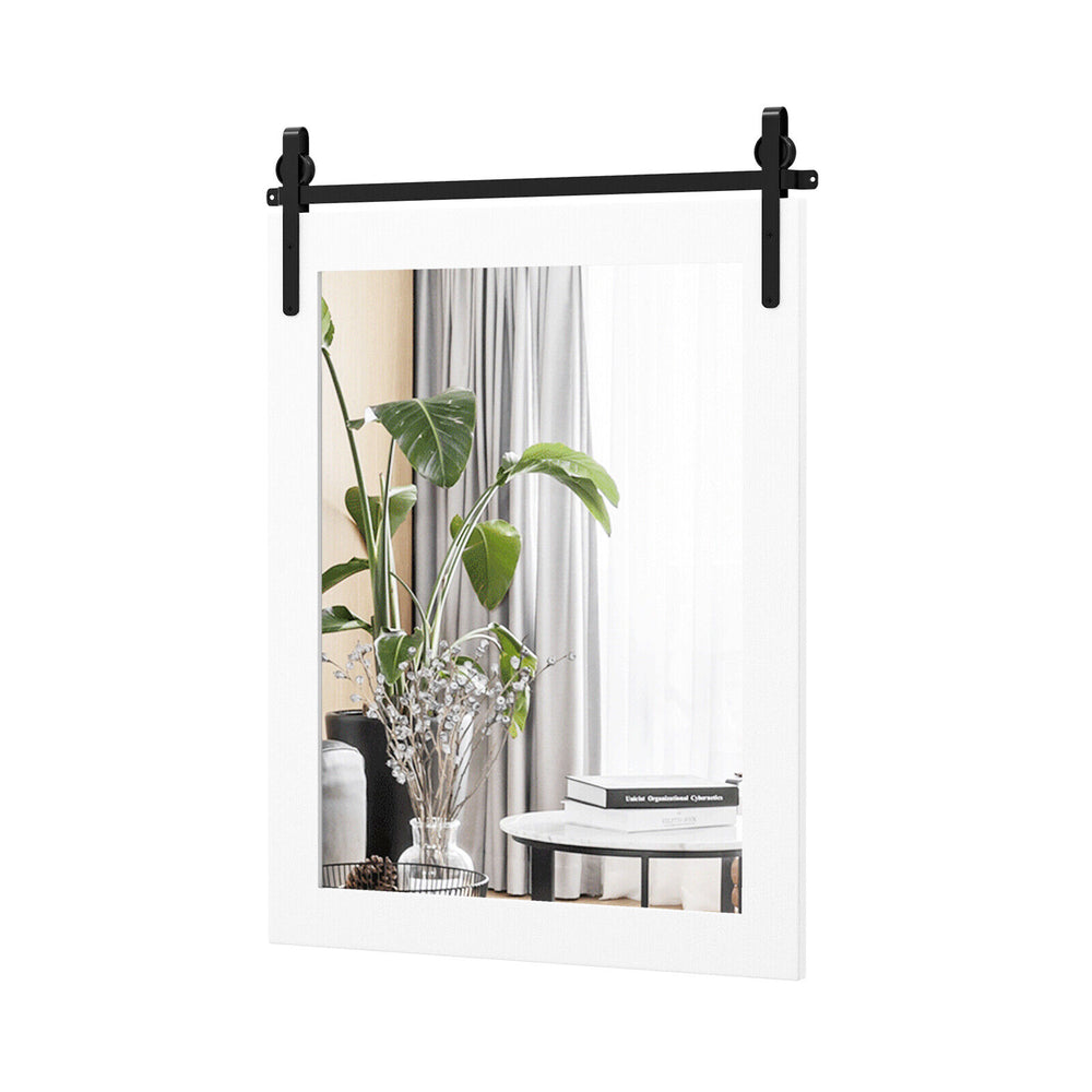 Wall-mounted mirror with a solid wood frame and black metal bracket, ideal for rustic decor in bedrooms or living rooms.