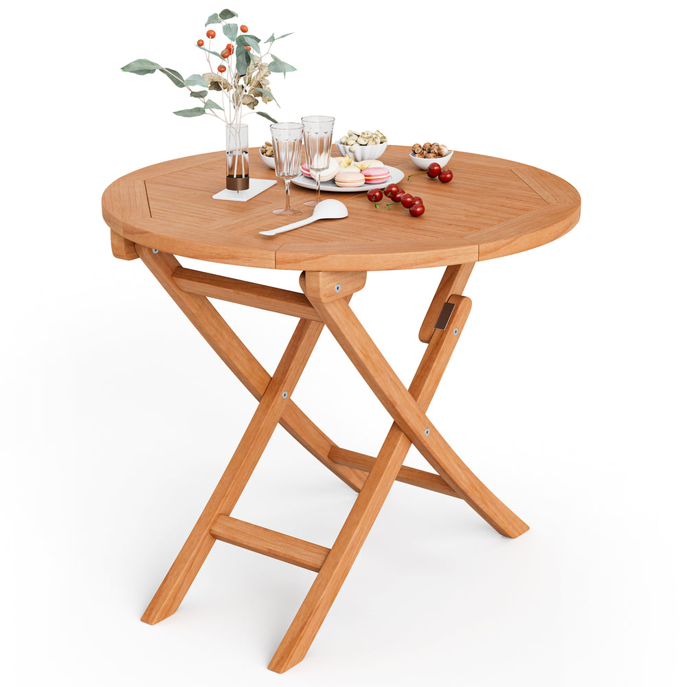 Round 31.5-inch folding coffee table made of teak wood, featuring an X-shaped structure, perfect for outdoor dining.