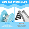 Freestanding blue baby slide with high armrests and anti-skid steps for safe indoor play and climbing.