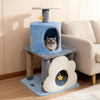 Multi-level blue cat tree with cloud-shaped cave, moon perch, and star toy for playful lounging and scratching.